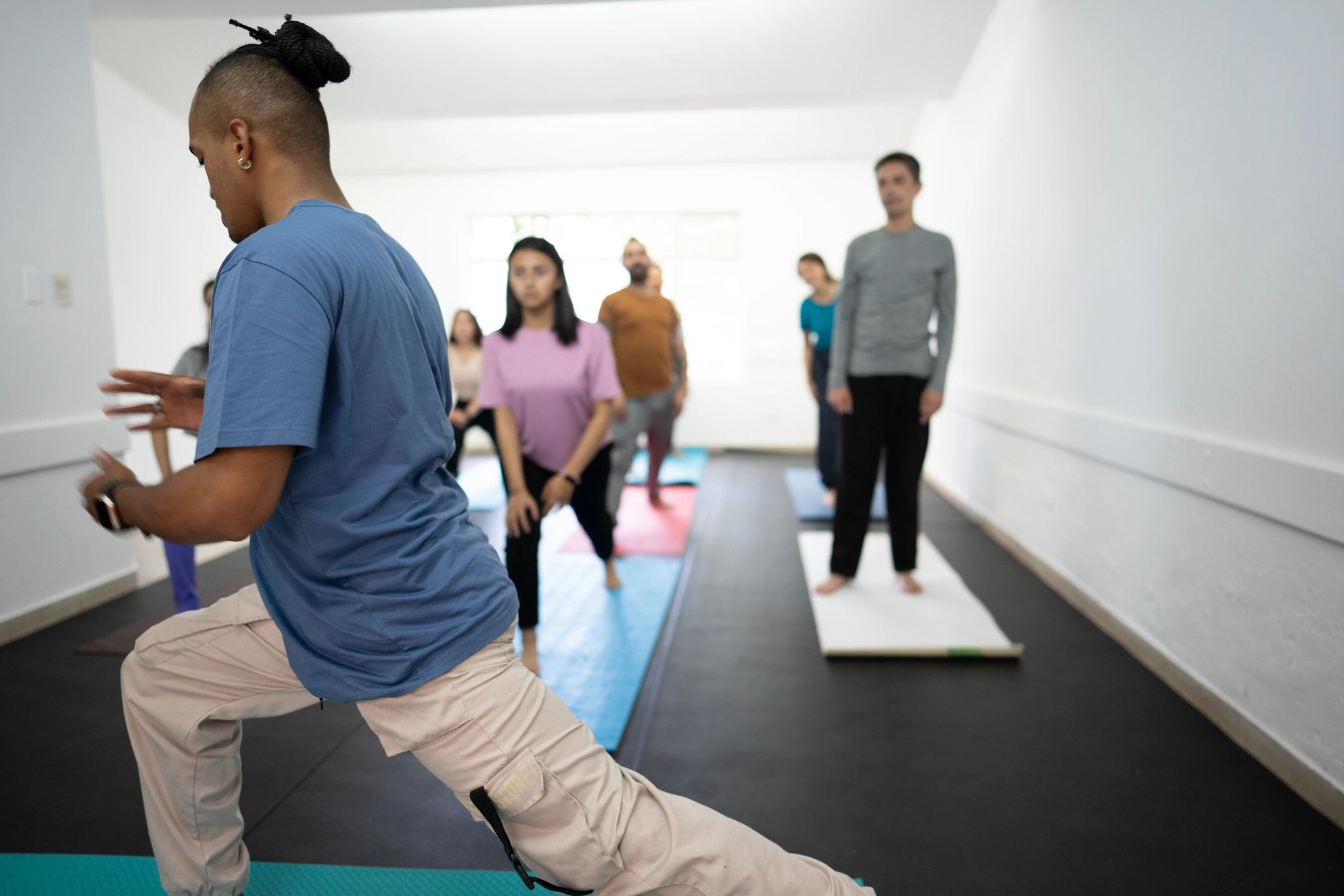 Instructor leading a fitness class with students