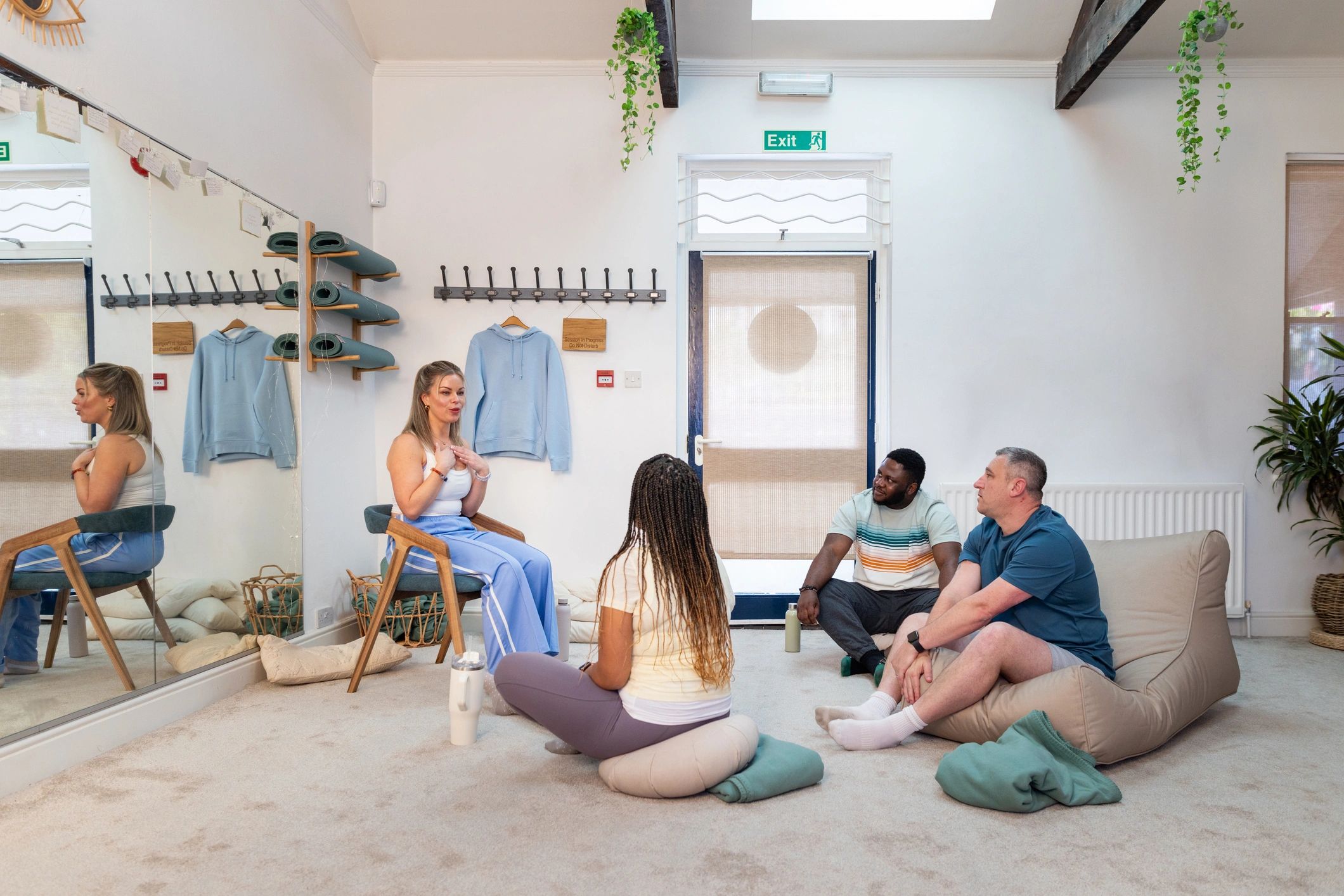 Instructor leading a wellbeing class discussion